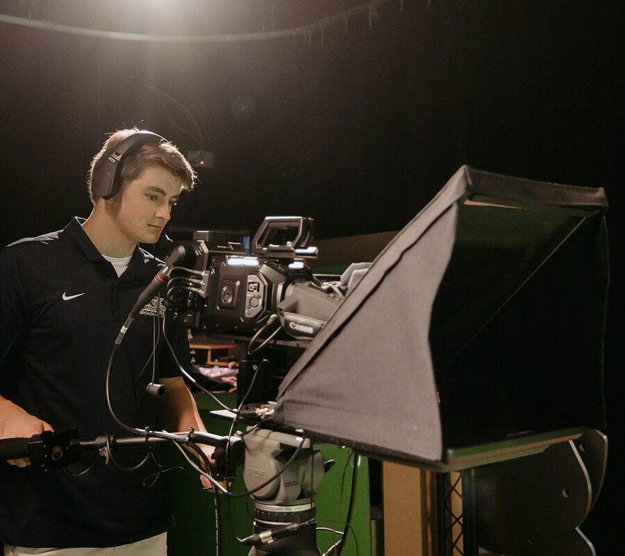 a PBA student uses a video camera