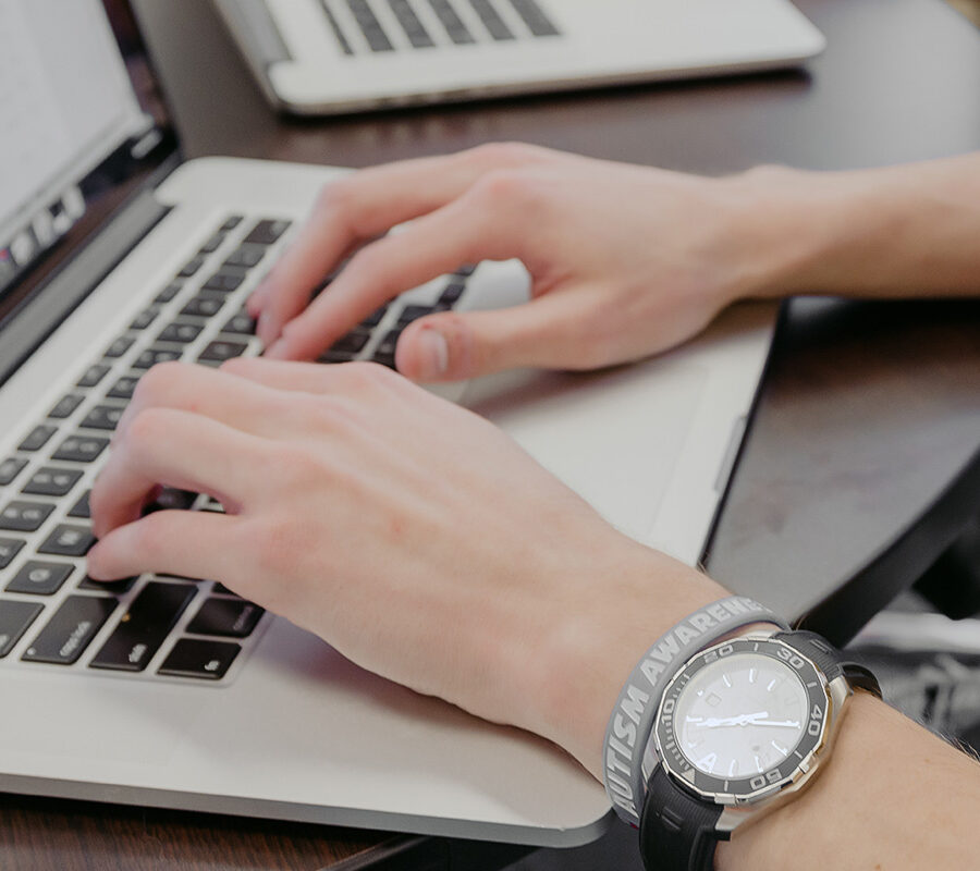 computer science student types on a keyboard.