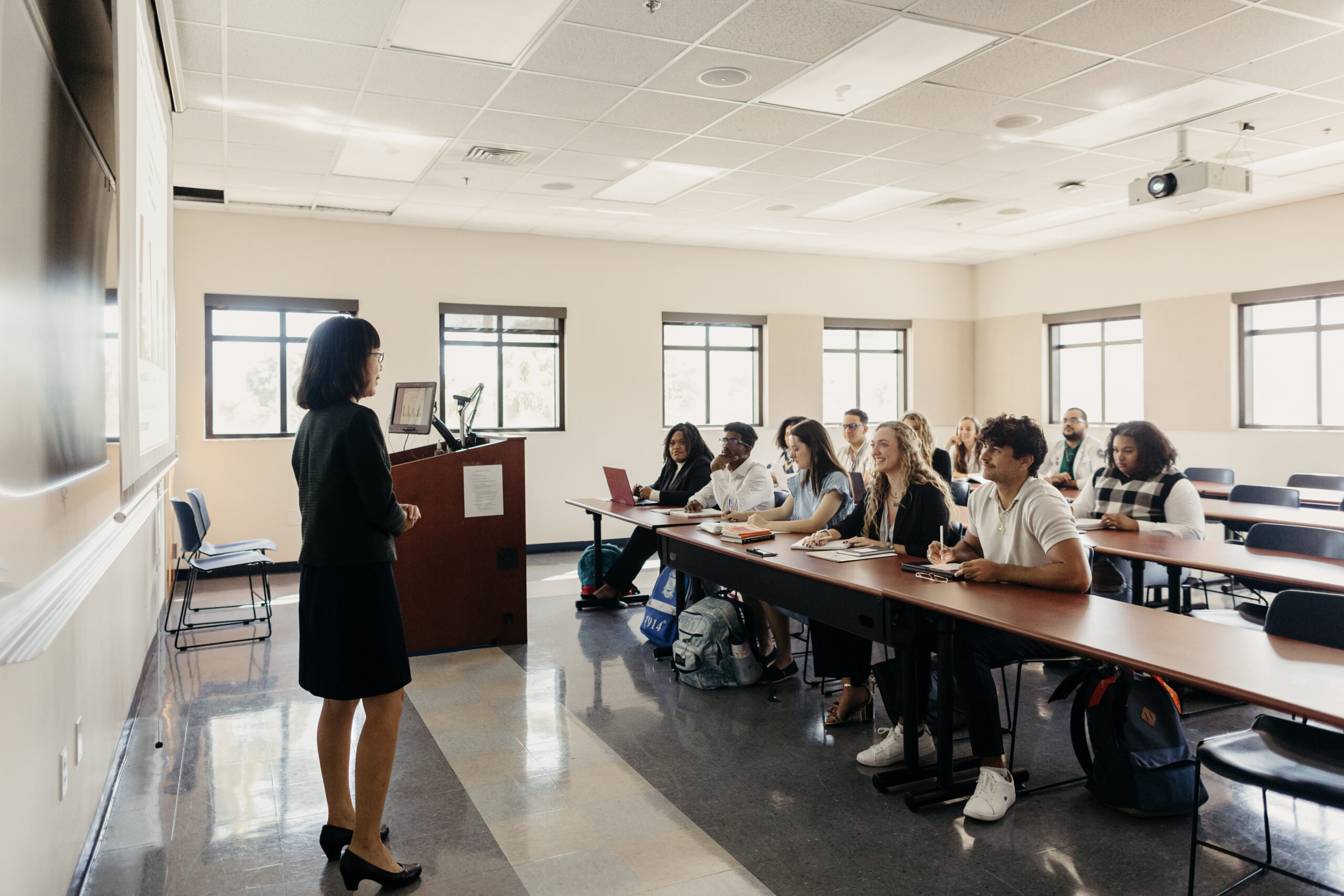 a professor speaking to a classroom full of students