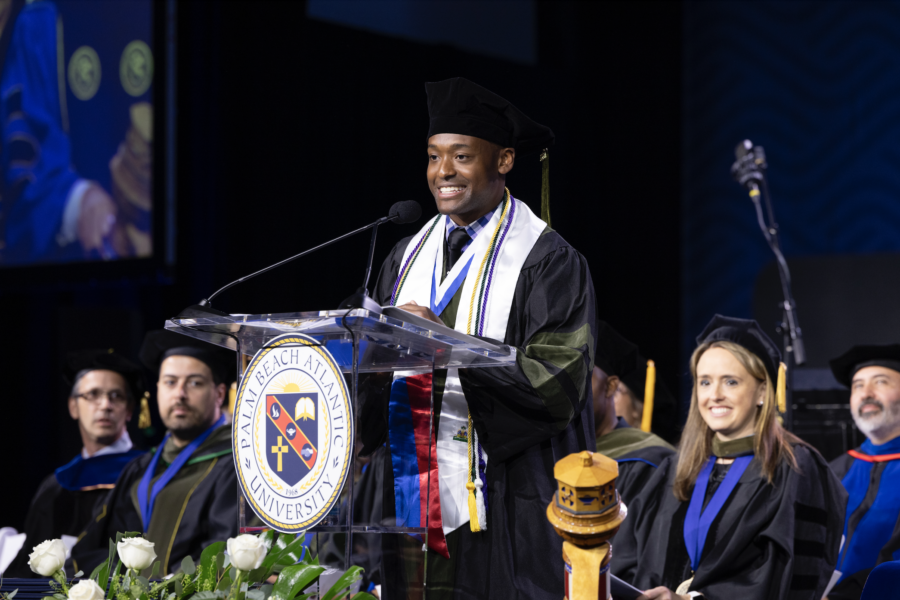 student speaking at graduation from the Professional Graduate Program