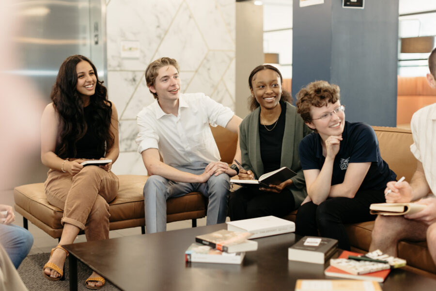 PBA Students sitting around a table smiling