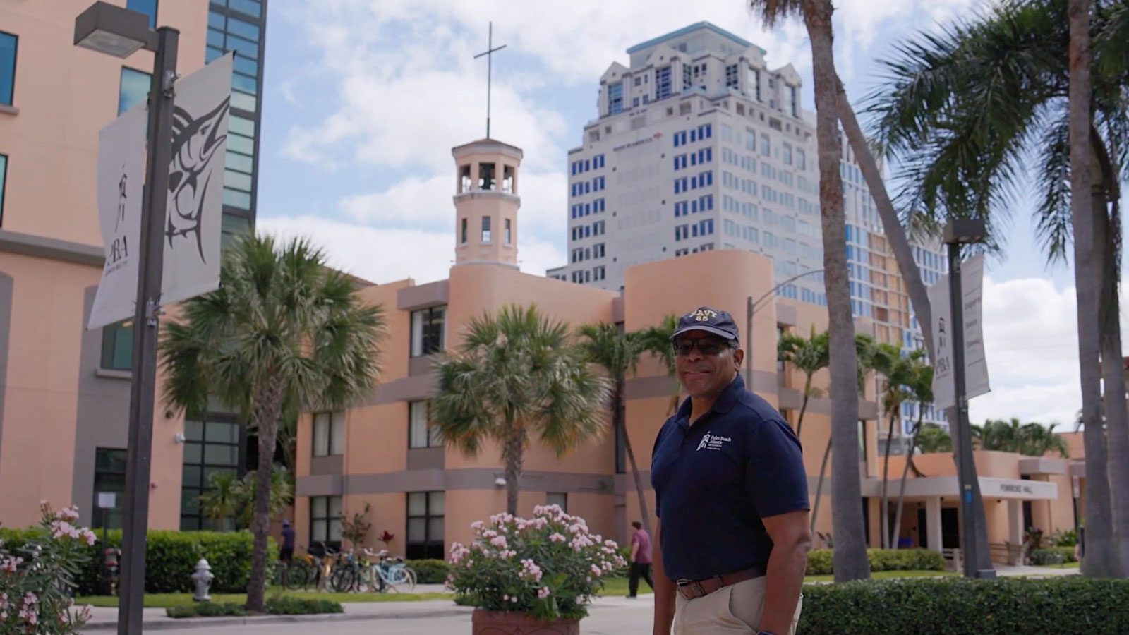 Dr. Thomas Parham stands in front of university buildings on PBA campus