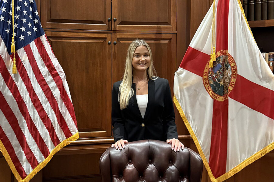 Myah standing behind Governor Desantis' desk