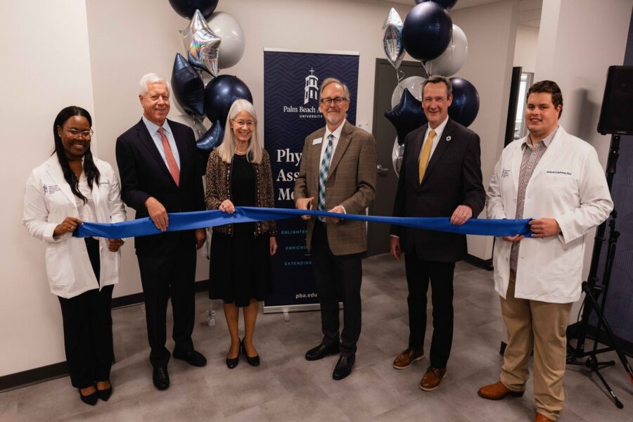 PBA executives cut the ribbon for PA program's new classroom space.