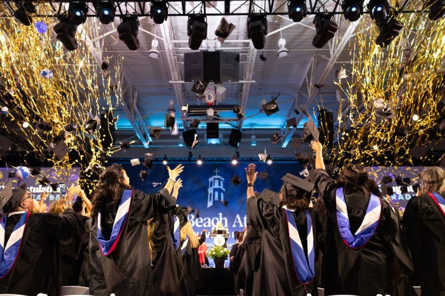 Confetti rains on Palm Beach Atlantic University Class of 2026 graduates.