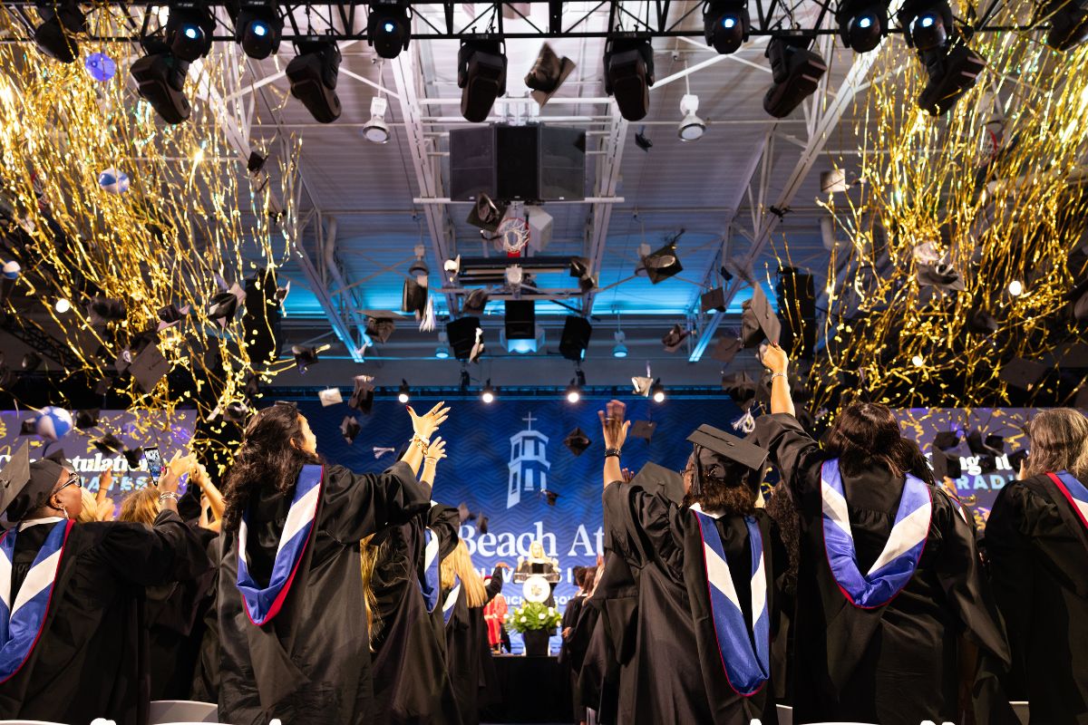 Confetti rains on Palm Beach Atlantic University Class of 2026 graduates.