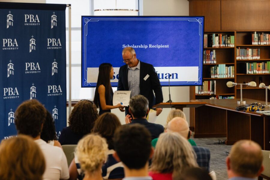 Palm Beach Atlantic University Rinker College of Business student Selena Yuan receives the BGS Honor Roll Scholarship.