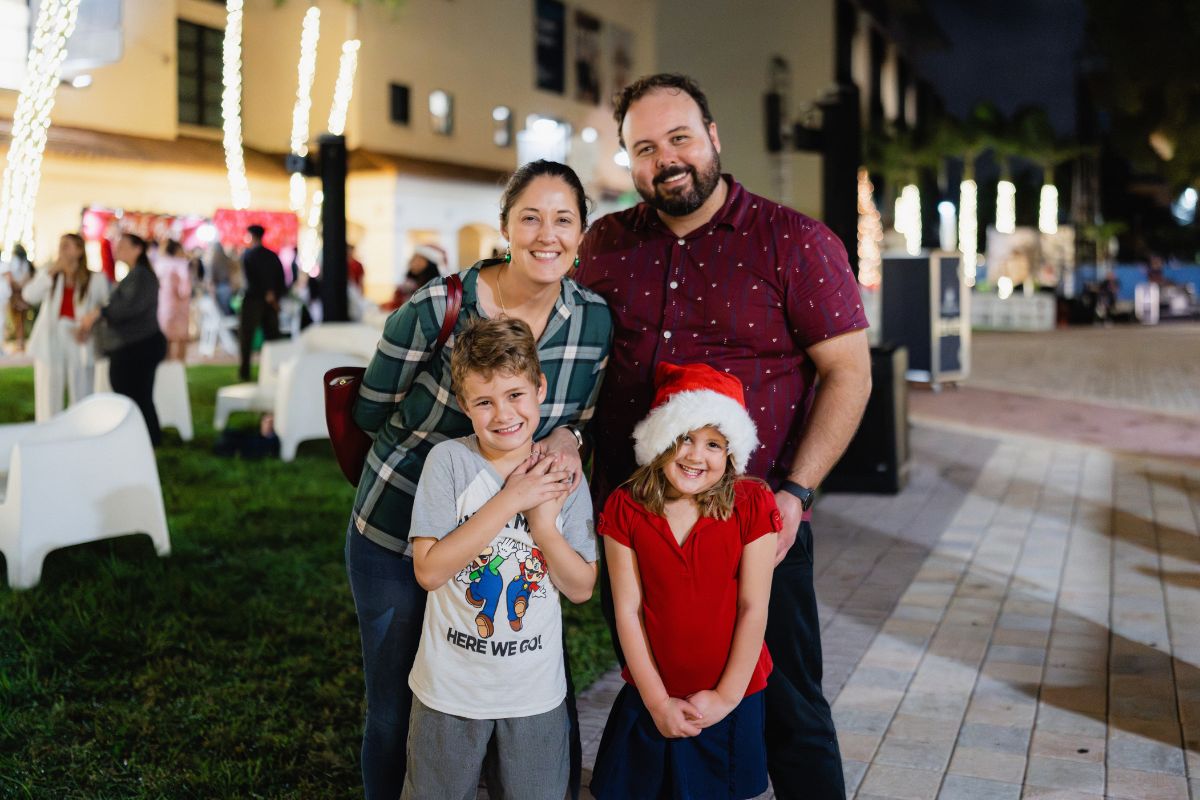 Palm Beach Atlantic University Donor Relations Coordinator Connor Dennis with his family at PBA's annual Christmas Tree Lighting.