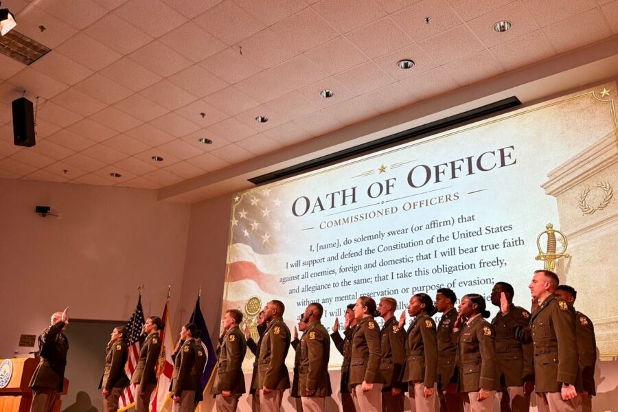 ROTC graduates are led in the Oath of Office.